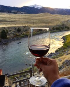 Enjoying Wine At Sunset Looking Out Into Yellowstone National Park